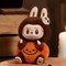 Pop Mart Labubu Sitting Pumpkin Plush Pendant - фото 49444